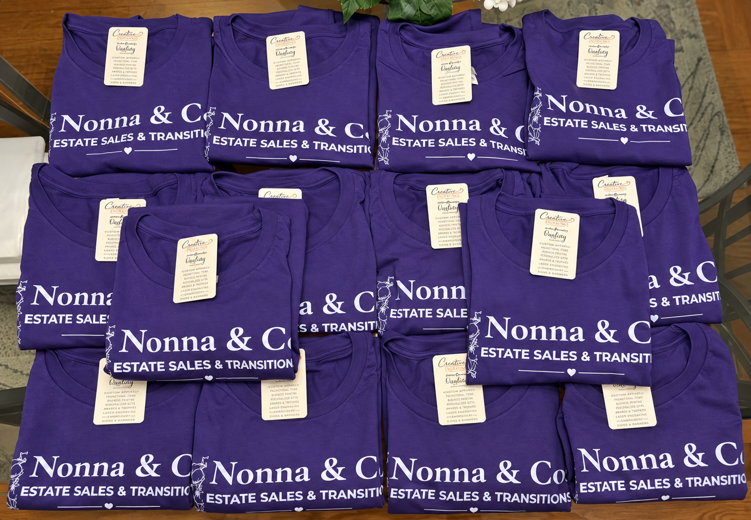 Completed batch of purple Nonna & Co. Estate Sales & Transitions shirts