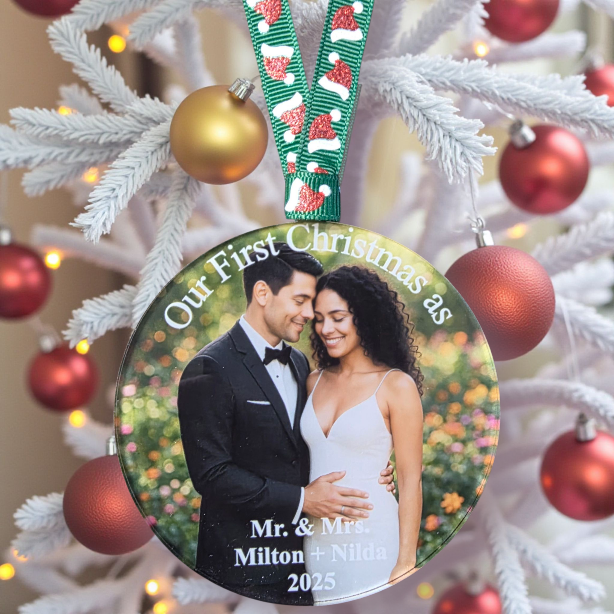 UV-printed acrylic Christmas ornament with a couple’s photograph and personalized first Christmas message